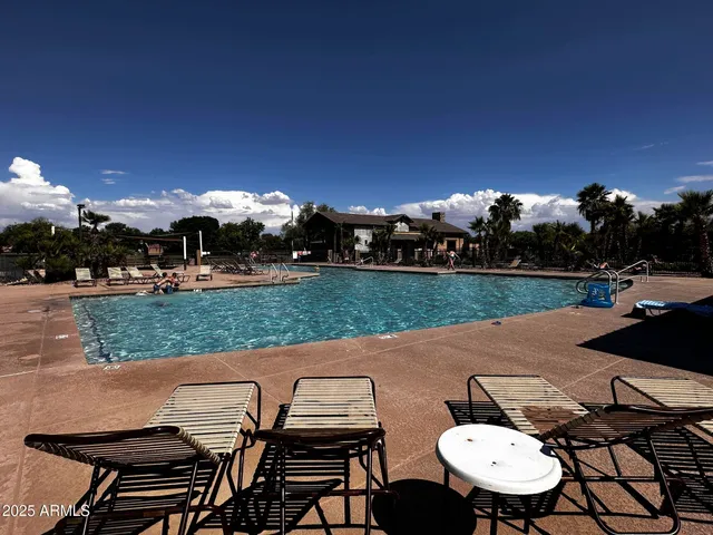 a view of a patio with table and chairs and potted plants