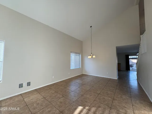 a view of an empty room with glass door