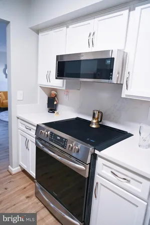 a kitchen with a stove and a microwave