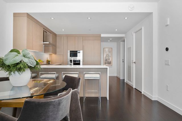 a kitchen with a table and chairs