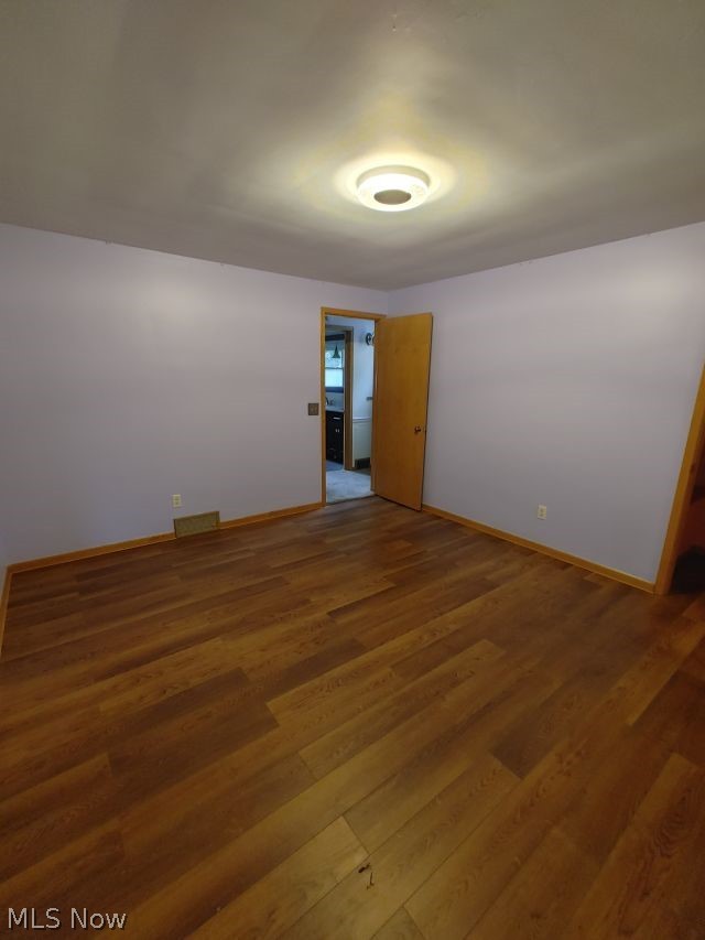 2211 Devonshire Road Northwest Canton, OH 44708 - Photo 18 of 36 Unfurnished room with wood-type flooring