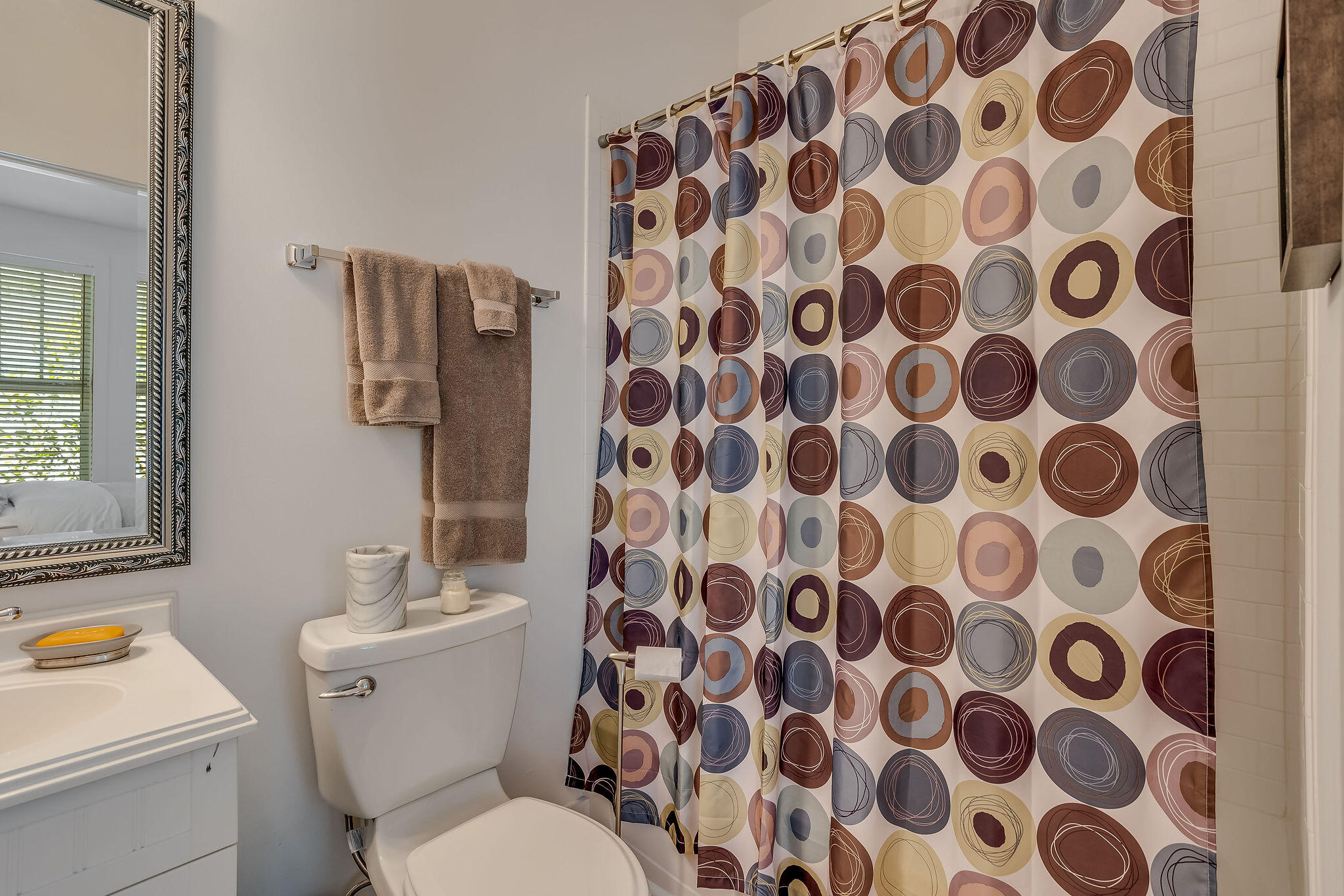 80 Okeechobee West Santa Rosa Beach, FL 32459 - Photo 16 of 38 a white toilet sitting next to a shower curtain