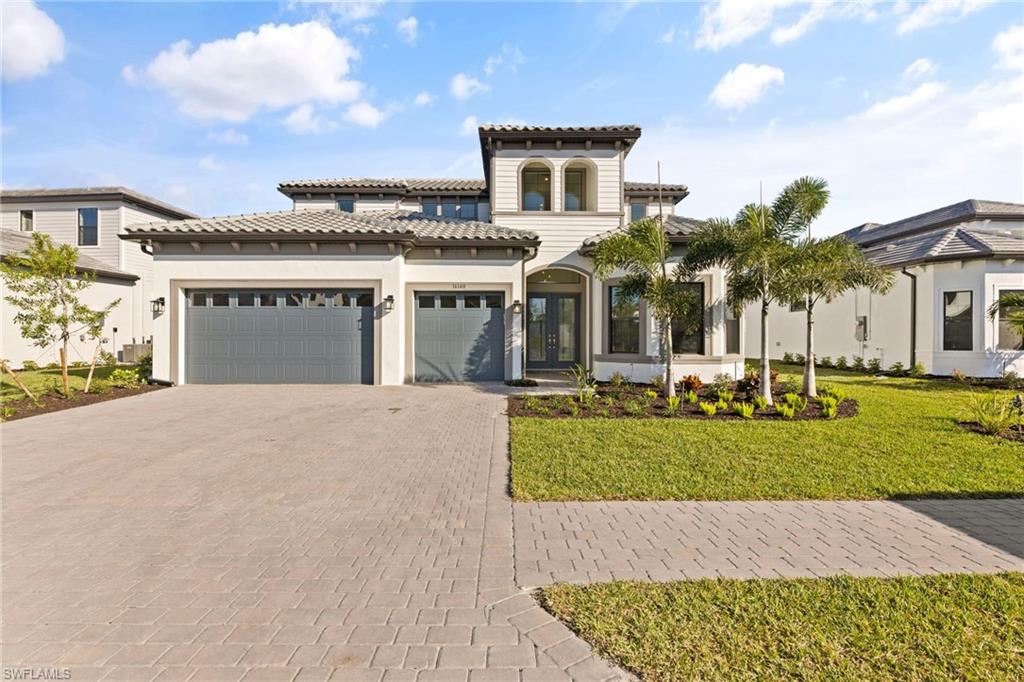 a front view of a house with a yard