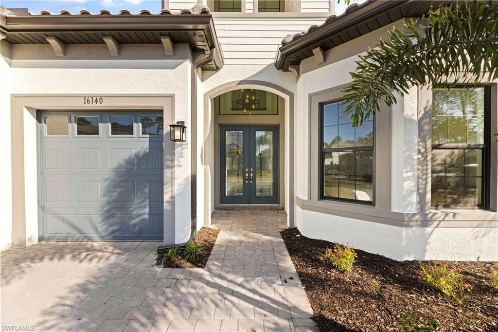 16140 Verilyn Circle Naples, FL 34110 - Photo 2 of 44 a front view of a house with a yard