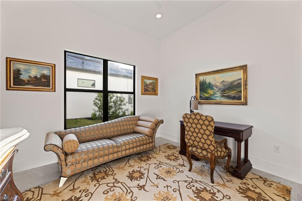 16140 Verilyn Circle Naples, FL 34110 - Photo 24 of 44 a living room with furniture and a window