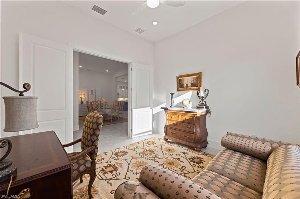 16140 Verilyn Circle Naples, FL 34110 - Photo 25 of 44 a bedroom with furniture and a window