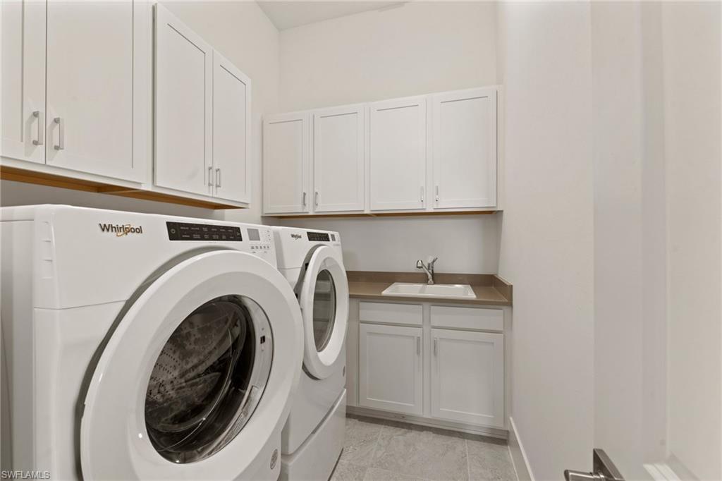 16140 Verilyn Circle Naples, FL 34110 - Photo 26 of 44 a utility room with sink dryer and washer