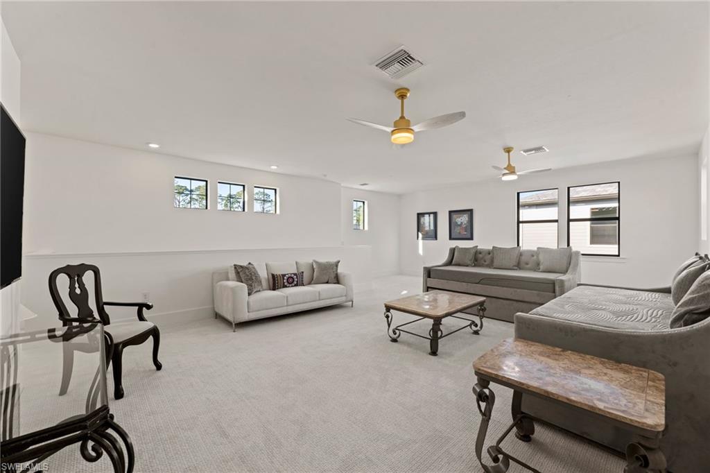 16140 Verilyn Circle Naples, FL 34110 - Photo 28 of 44 a living room with furniture and a piano