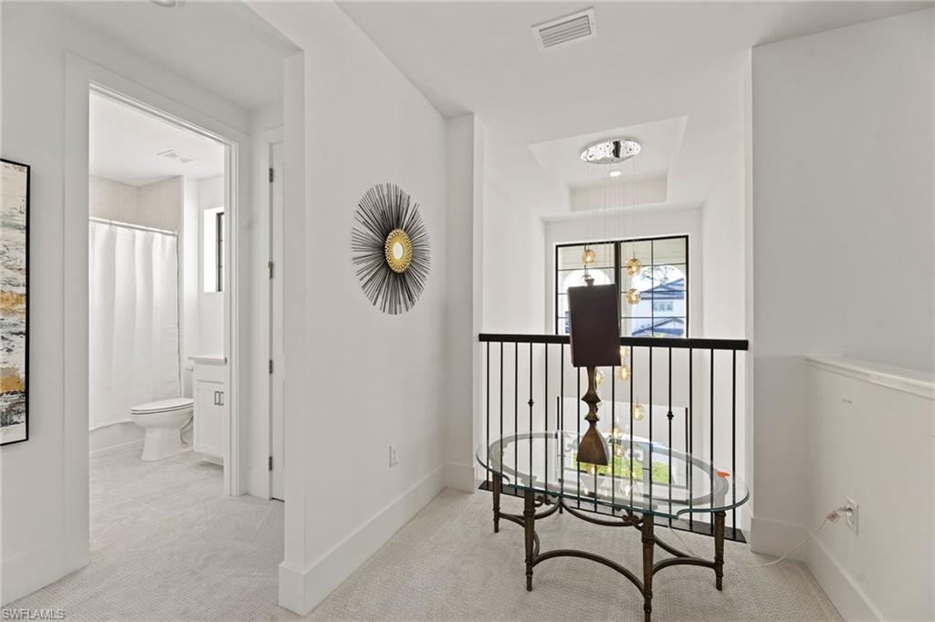 16140 Verilyn Circle Naples, FL 34110 - Photo 29 of 44 a room that has a rug and a chair in it