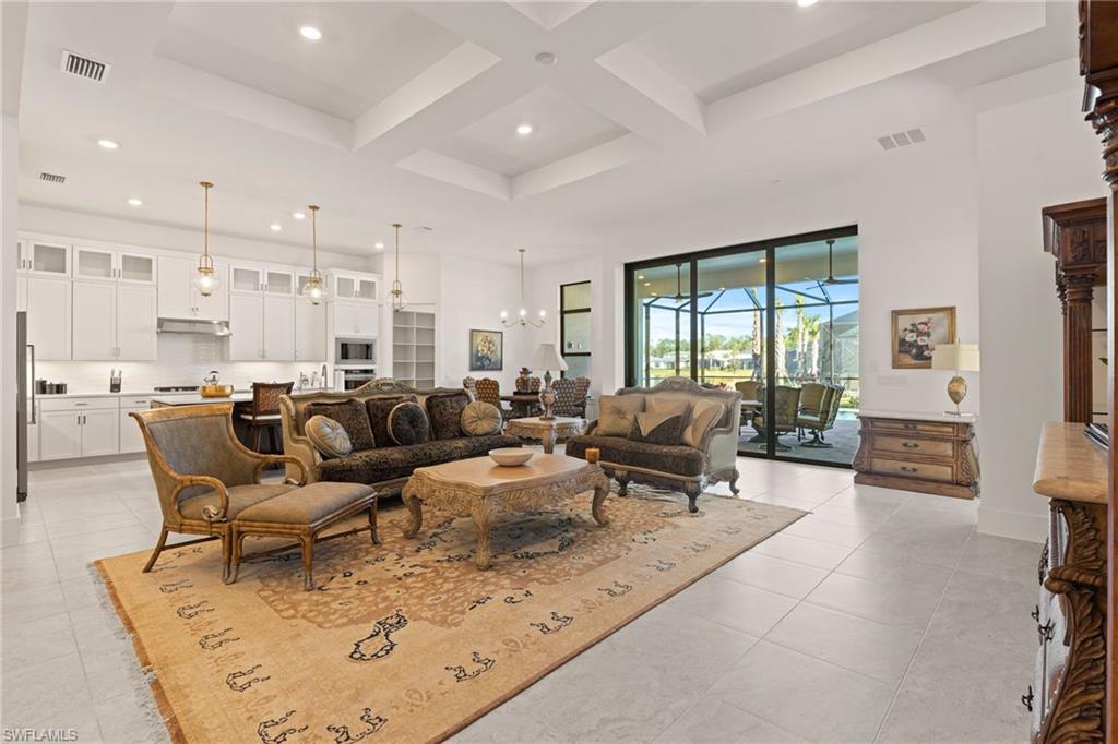 16140 Verilyn Circle Naples, FL 34110 - Photo 3 of 44 a living room with lots of furniture and a large window