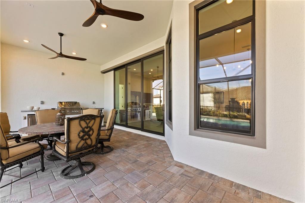 16140 Verilyn Circle Naples, FL 34110 - Photo 34 of 44 a view of a workspace with furniture and a window