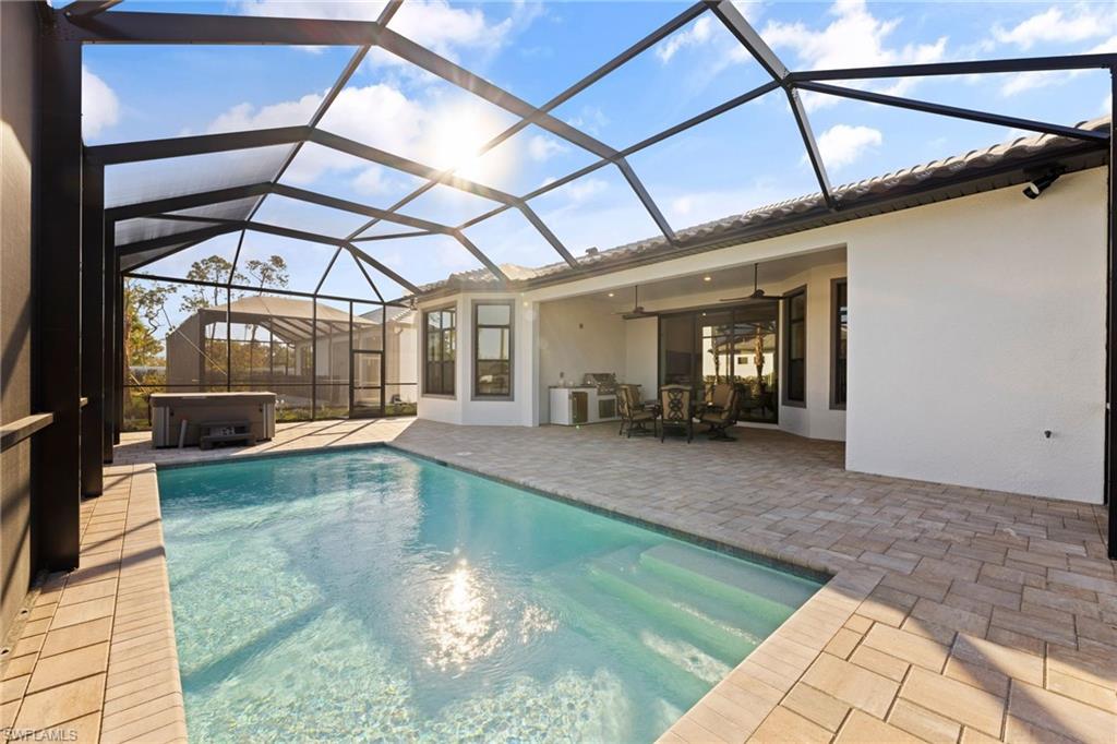 16140 Verilyn Circle Naples, FL 34110 - Photo 37 of 44 a view of a swimming pool with a patio