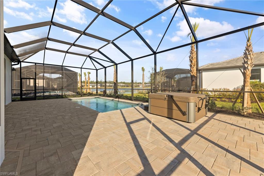 16140 Verilyn Circle Naples, FL 34110 - Photo 38 of 44 a view of a swimming pool with a porch