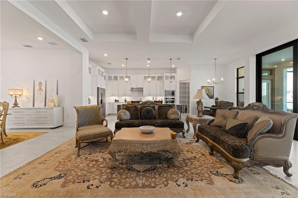 16140 Verilyn Circle Naples, FL 34110 - Photo 4 of 44 a living room with furniture and a rug