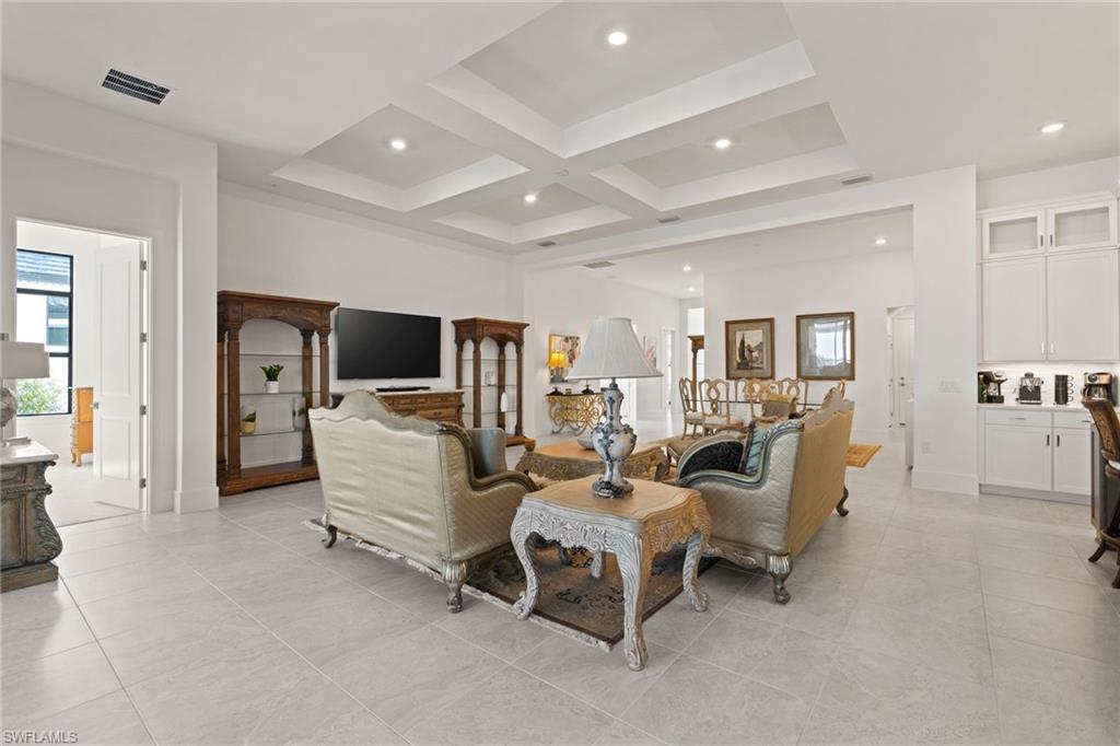 16140 Verilyn Circle Naples, FL 34110 - Photo 5 of 44 a living room with furniture and a flat screen tv