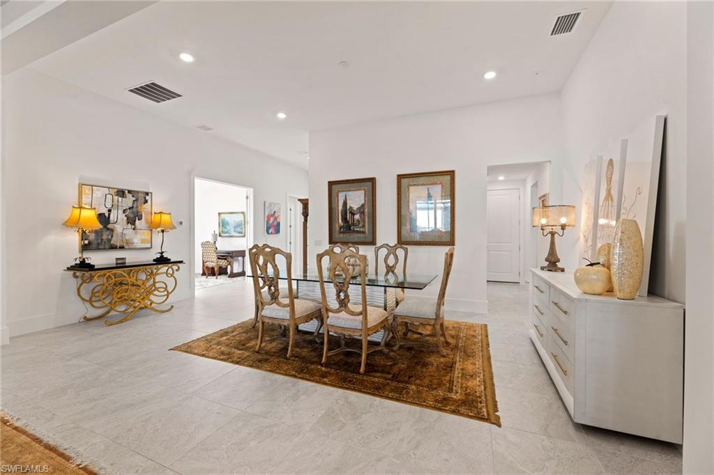 16140 Verilyn Circle Naples, FL 34110 - Photo 7 of 44 a view of a dining room with furniture and a chandelier
