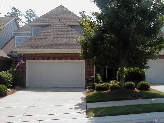 3419 Barron Berkeley Way Raleigh, NC 27612 - Photo 1 of 1 a front view of a house with garden