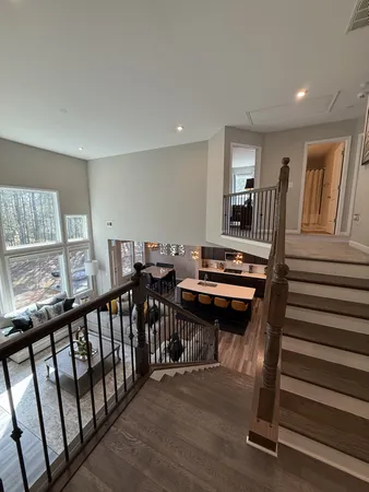 a view of a hallway with seating area