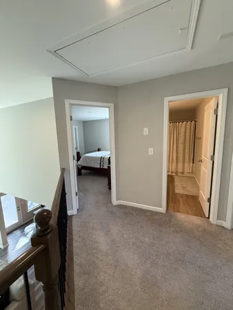 a view of a room that has a bed