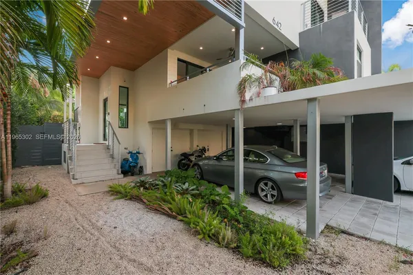 a view of a chair and tables in patio of the house