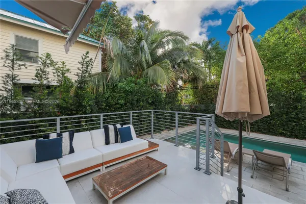 a view of sitting area with furniture and wooden deck