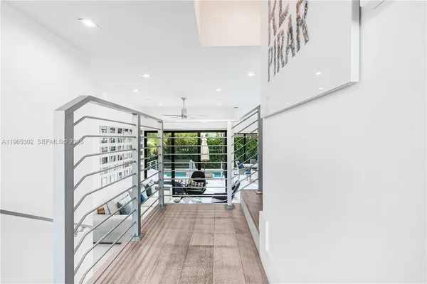 a view of a living room and a balcony