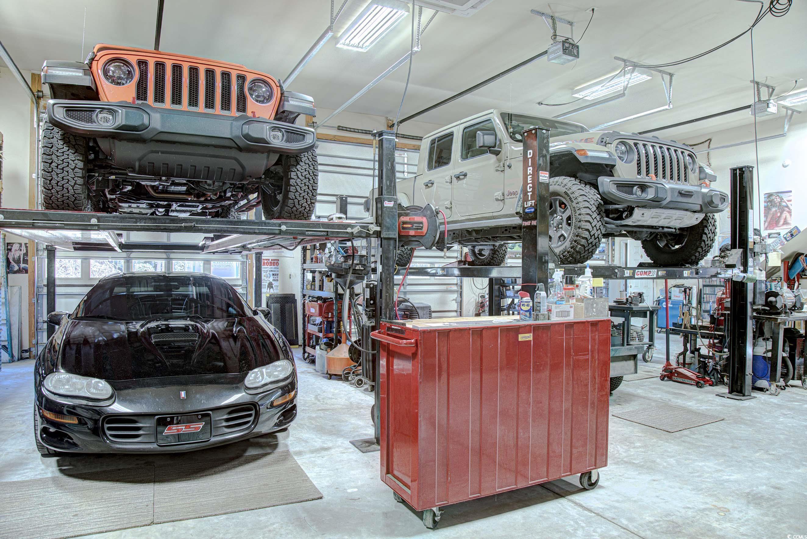 3637 Choppee Road Georgetown, SC 29440 - Photo 29 of 40 Garage featuring a workshop area and a garage door opener