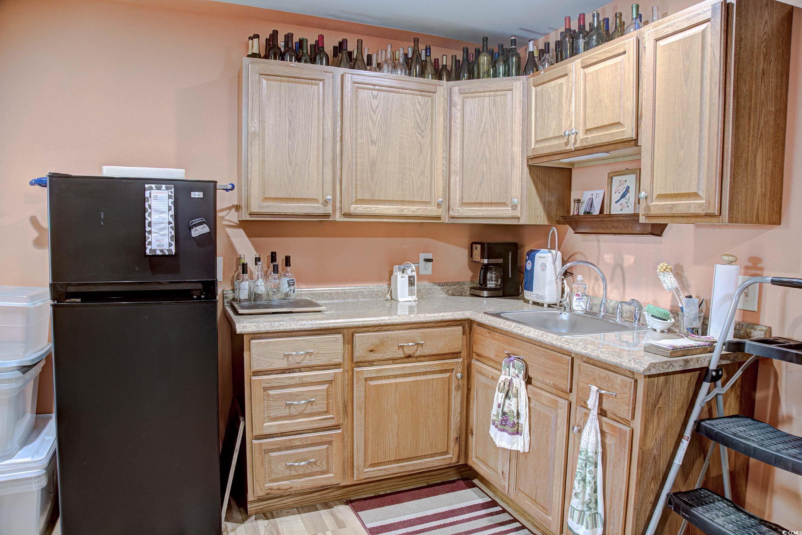 3637 Choppee Road Georgetown, SC 29440 - Photo 32 of 40 Kitchen featuring freestanding refrigerator, light countertops, and light brown cabinetry