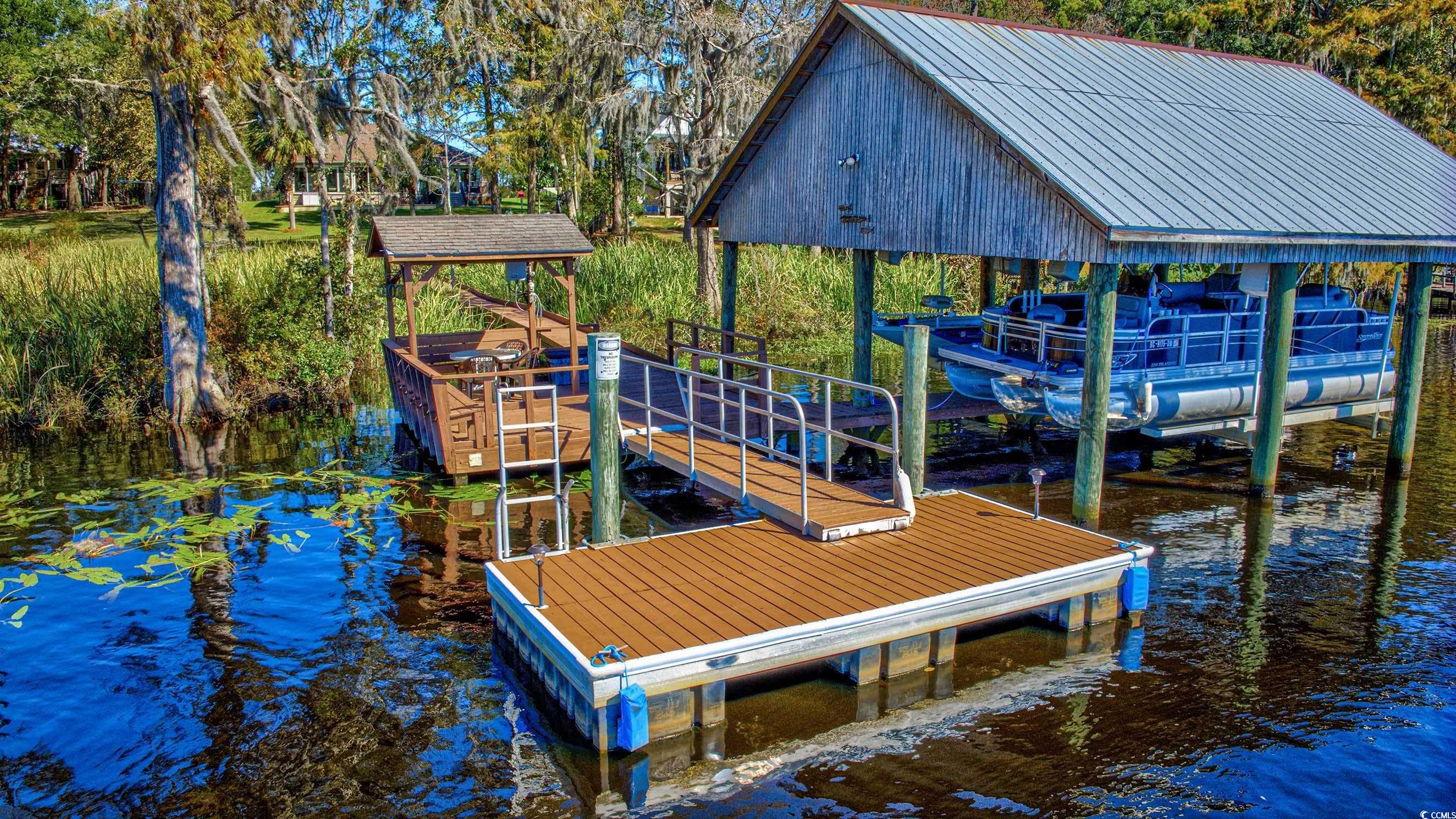 3637 Choppee Road Georgetown, SC 29440 - Photo 34 of 40 Dock with a water view and boat lift