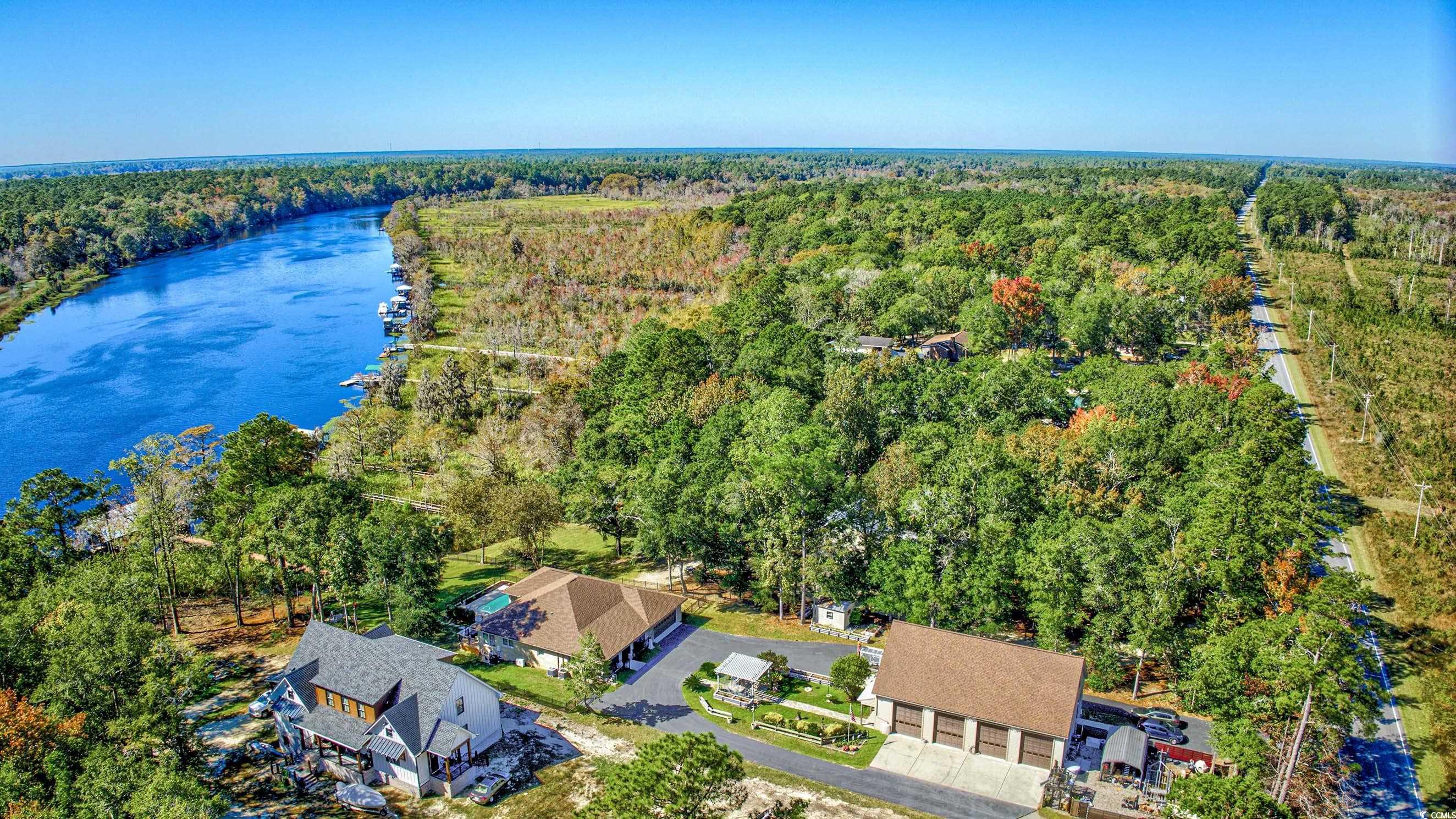 3637 Choppee Road Georgetown, SC 29440 - Photo 37 of 40 Aerial view of a nearby body of water and a heavily wooded area