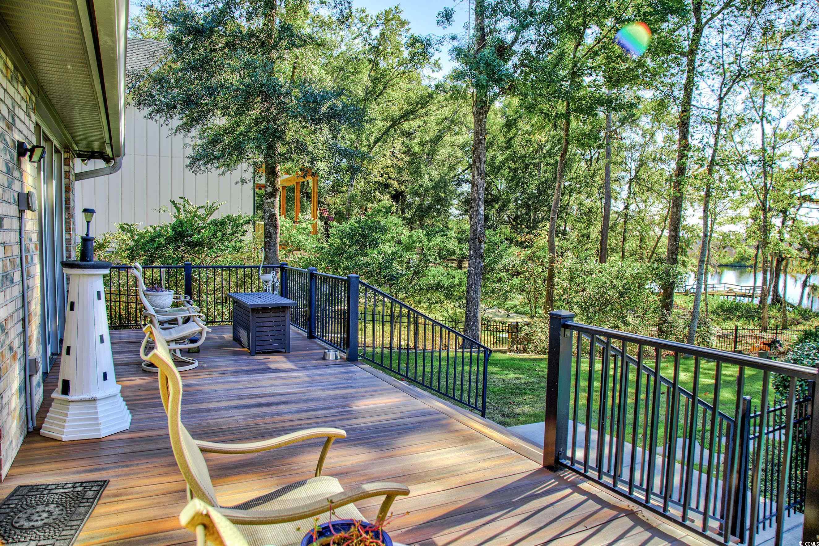 3637 Choppee Road Georgetown, SC 29440 - Photo 5 of 40 Wooden terrace with a yard and a water view
