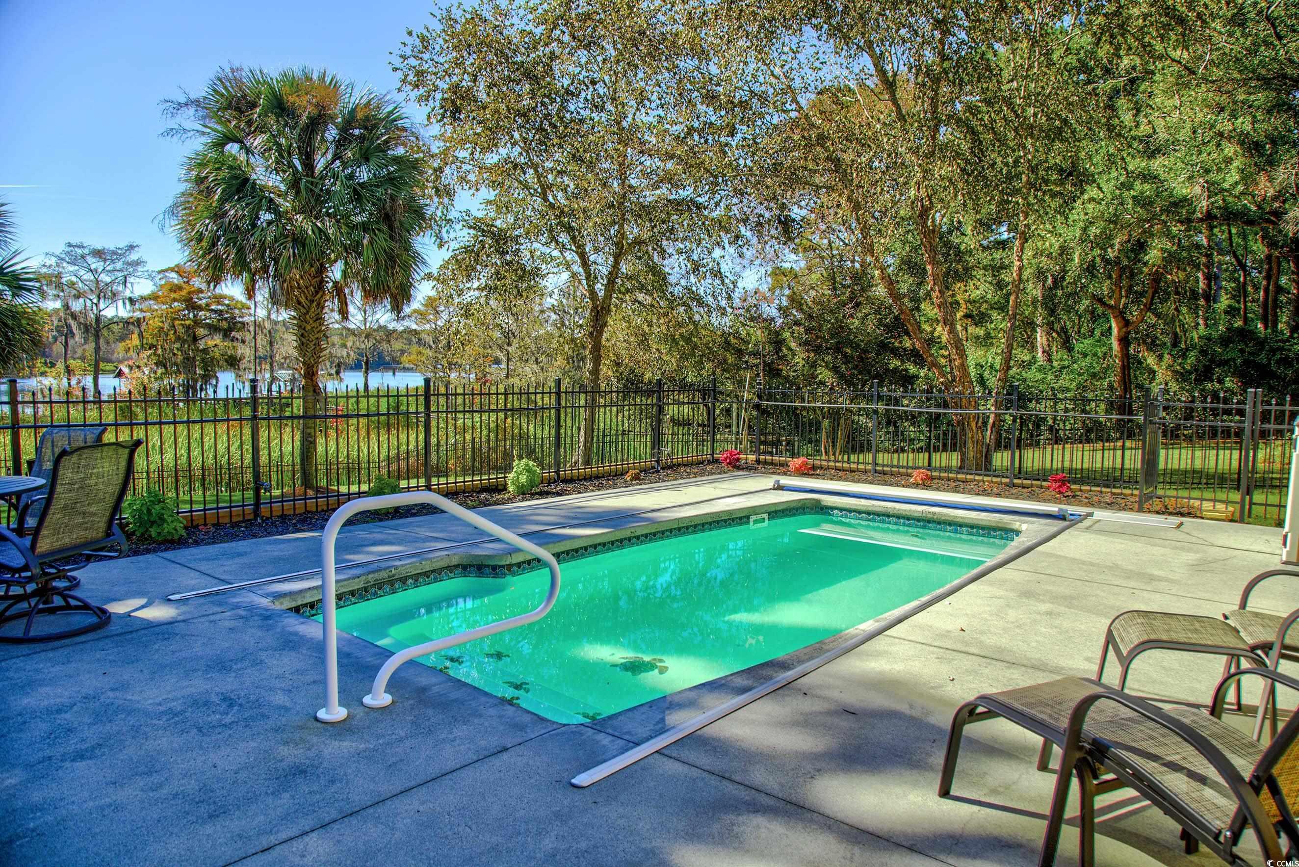 3637 Choppee Road Georgetown, SC 29440 - Photo 7 of 40 View of swimming pool featuring a patio area and a fenced backyard