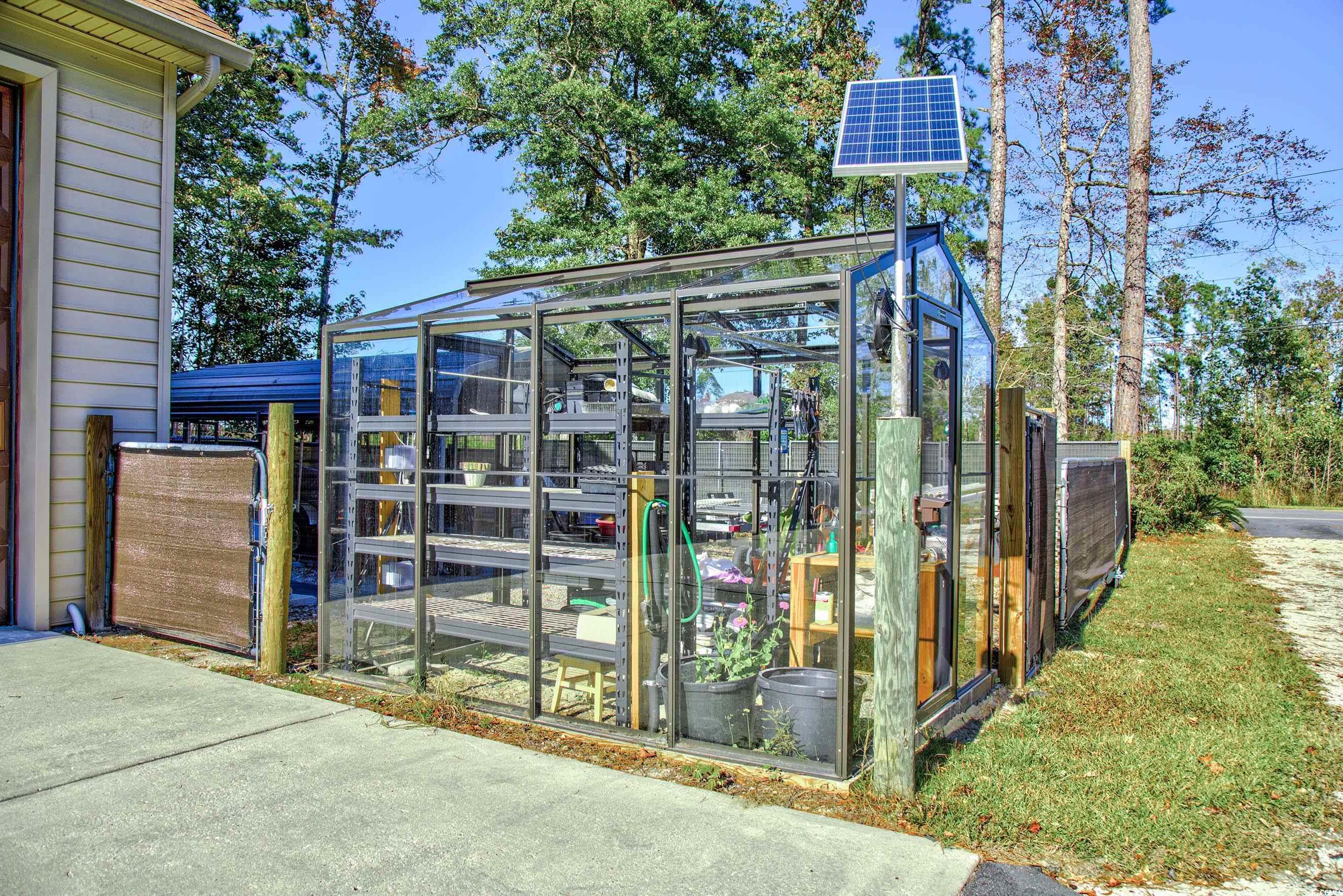 3637 Choppee Road Georgetown, SC 29440 - Photo 8 of 40 View of greenhouse with solar panels. Heated and plumbed. 8X10
