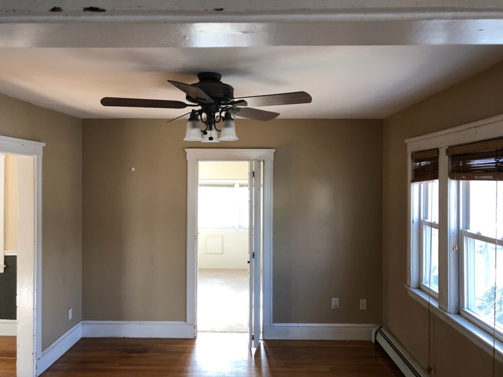33 Argyle Road, Unit 33 Braintree, MA 02184 - Photo 2 of 9 a view of room with a window and wooden floor