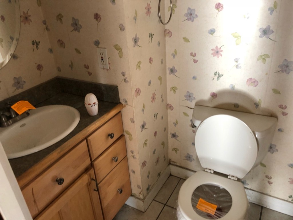 33 Argyle Road, Unit 33 Braintree, MA 02184 - Photo 6 of 9 a bathroom with a toilet and a mirror