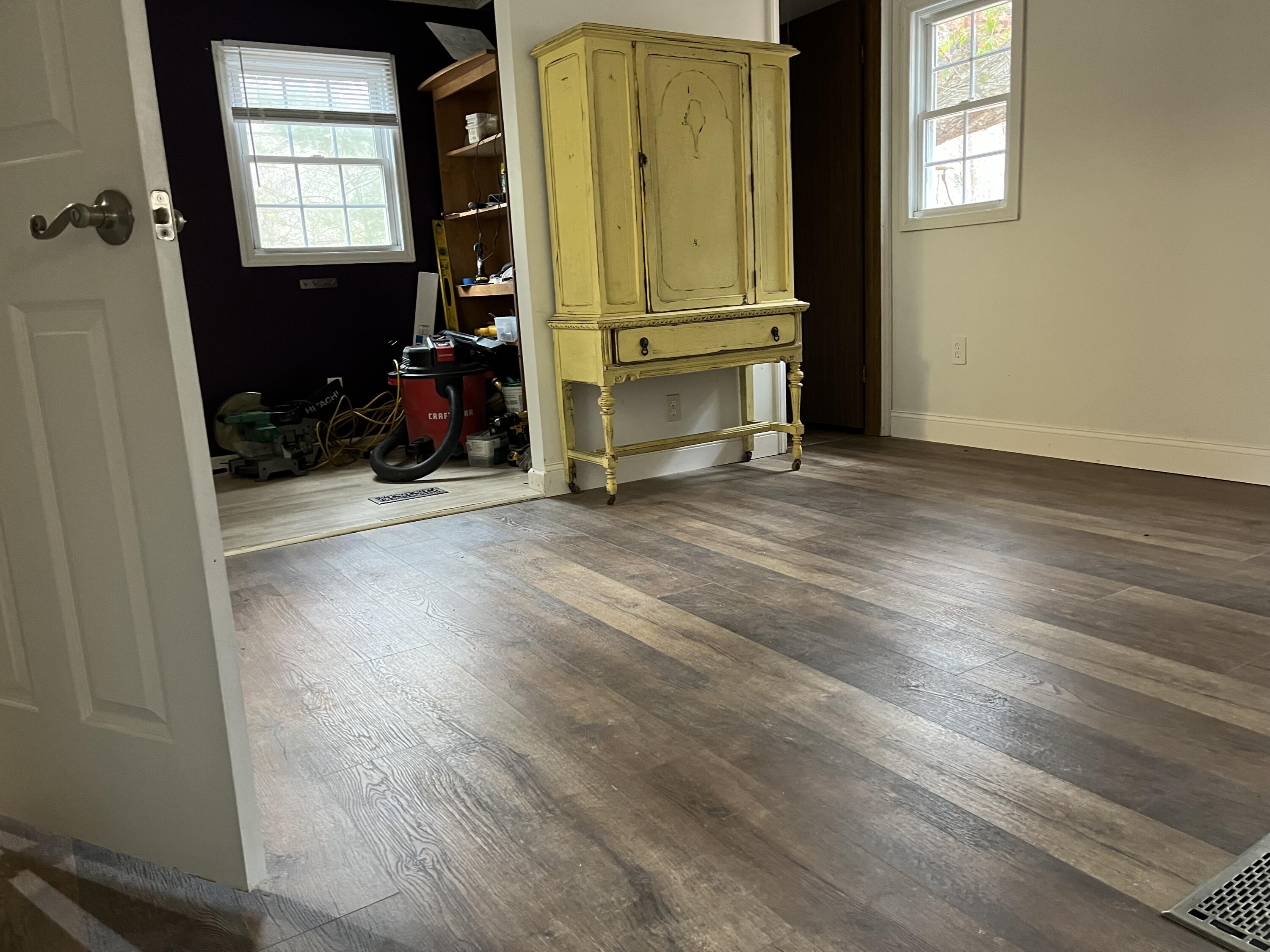 108 Meadowlark Road Blue Ridge, VA 24064 - Photo 11 of 14 an empty room with wooden floor and windows
