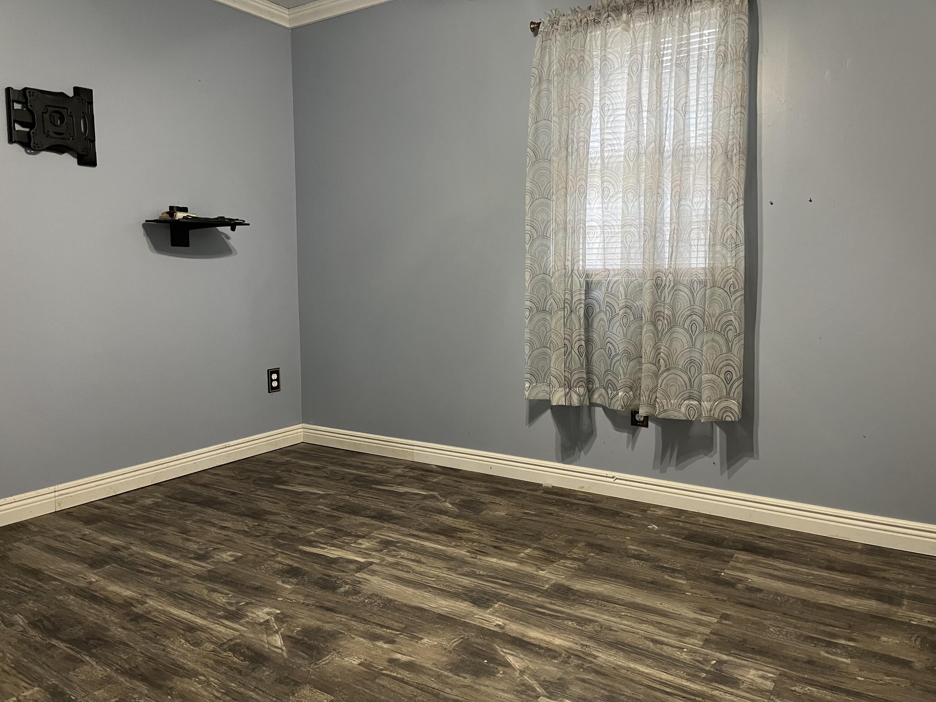 108 Meadowlark Road Blue Ridge, VA 24064 - Photo 4 of 14 wooden floor and window in an empty room
