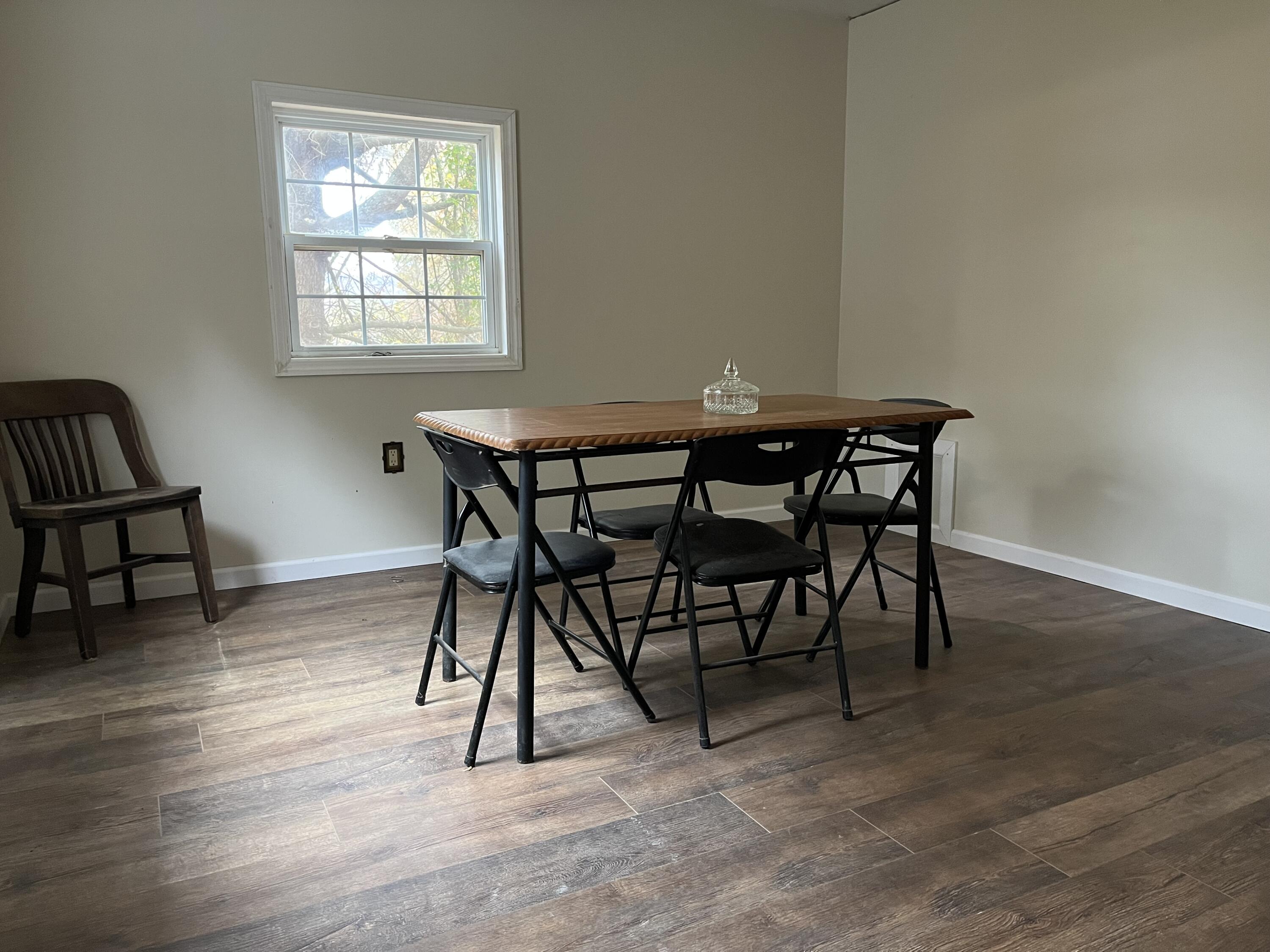 108 Meadowlark Road Blue Ridge, VA 24064 - Photo 10 of 14 a view of a dining room with furniture and wooden floor