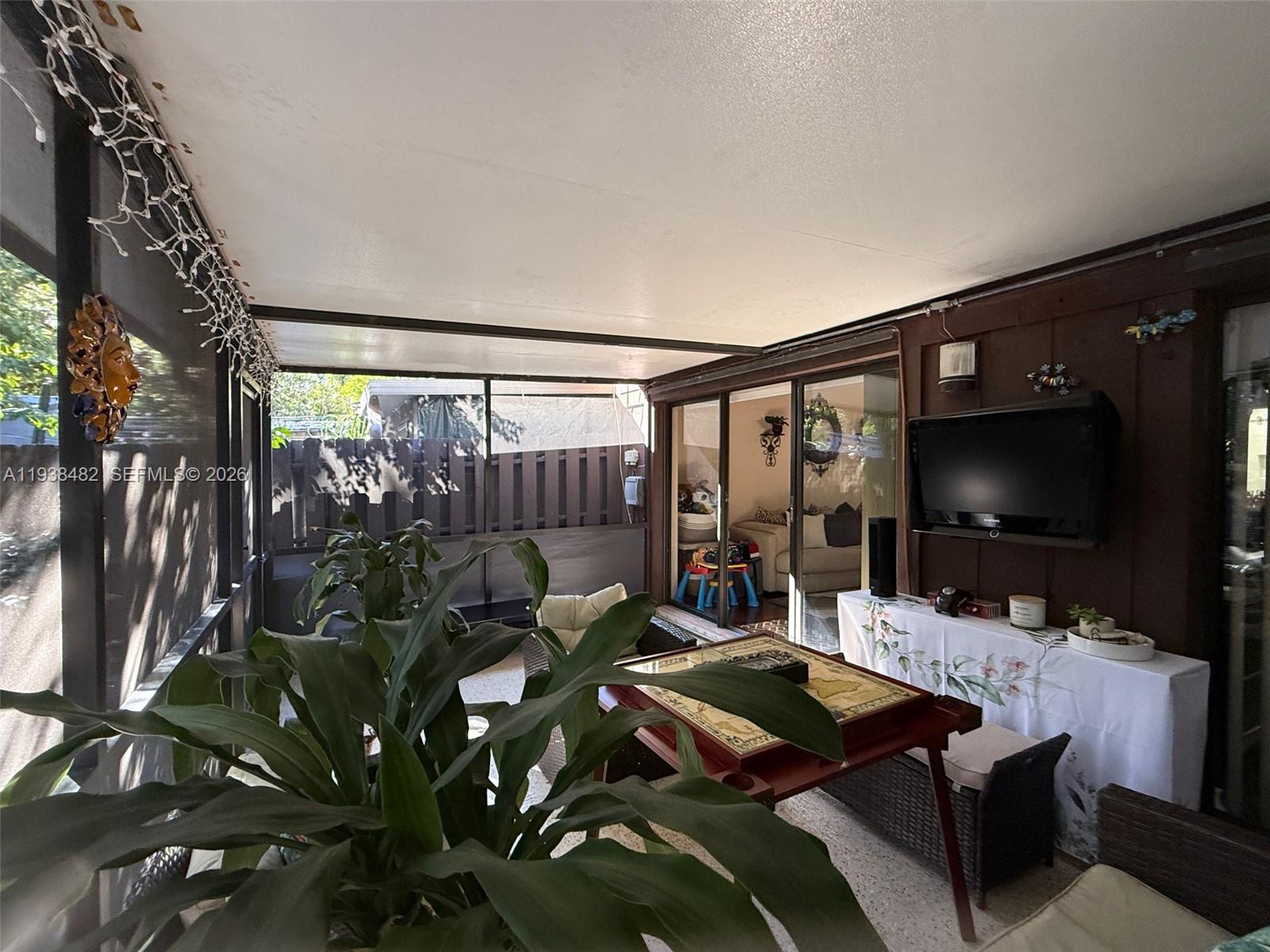 3415 Freedom Drive Hollywood, FL 33021 - Photo 11 of 49 a living room with furniture and a flat screen tv