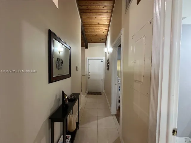 a bathroom with a mirror and a shower