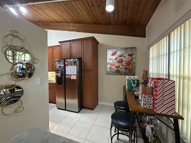 a workspace with furniture and a chandelier