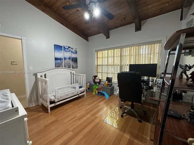 a bedroom with furniture and a window