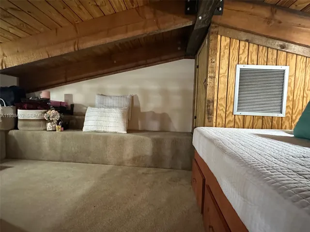 a bedroom with bed and window