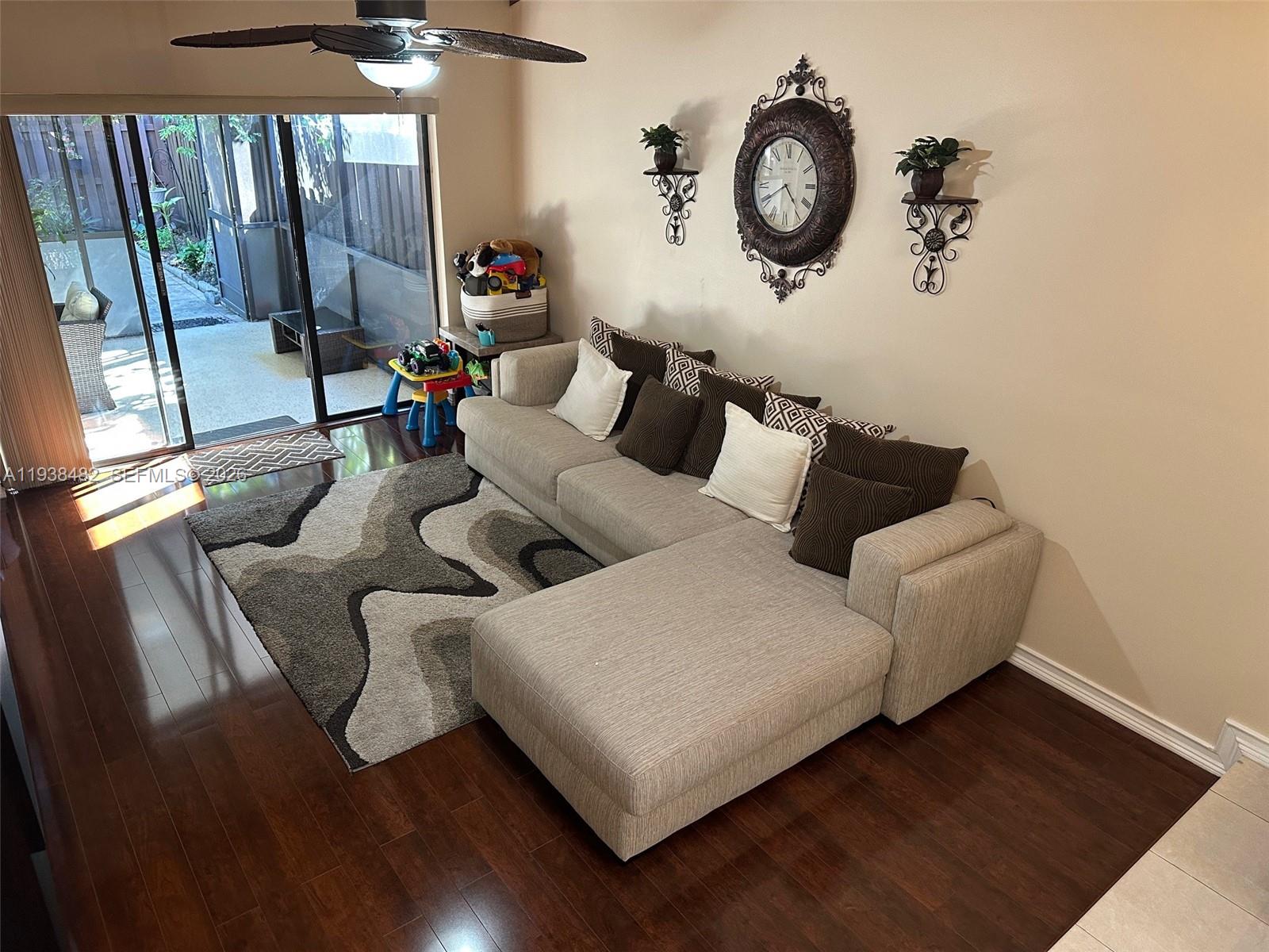 3415 Freedom Drive Hollywood, FL 33021 - Photo 35 of 49 a living room with furniture and a clock