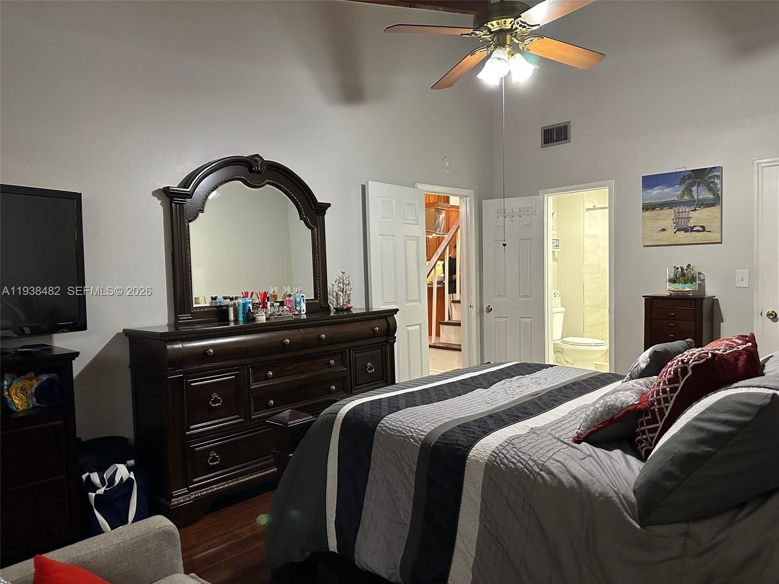 3415 Freedom Drive Hollywood, FL 33021 - Photo 40 of 49 a bedroom with a bed and a flat tv screen on dresser