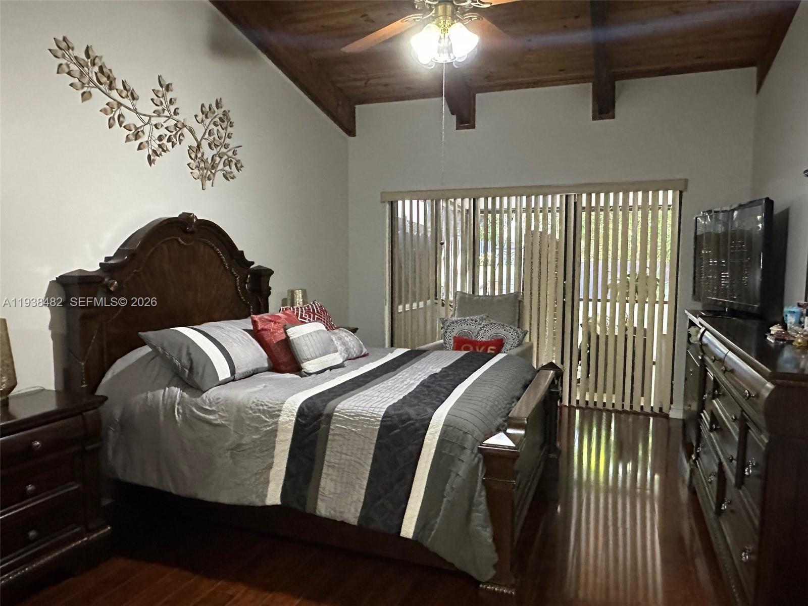 3415 Freedom Drive Hollywood, FL 33021 - Photo 42 of 49 a bed sitting in a bedroom next to a window