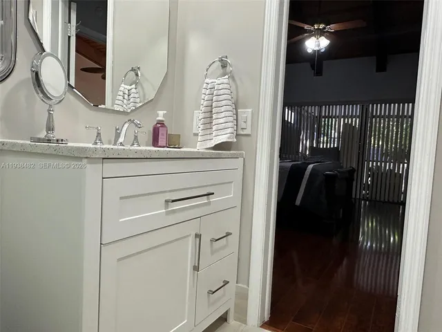 a bathroom with a sink and a mirror