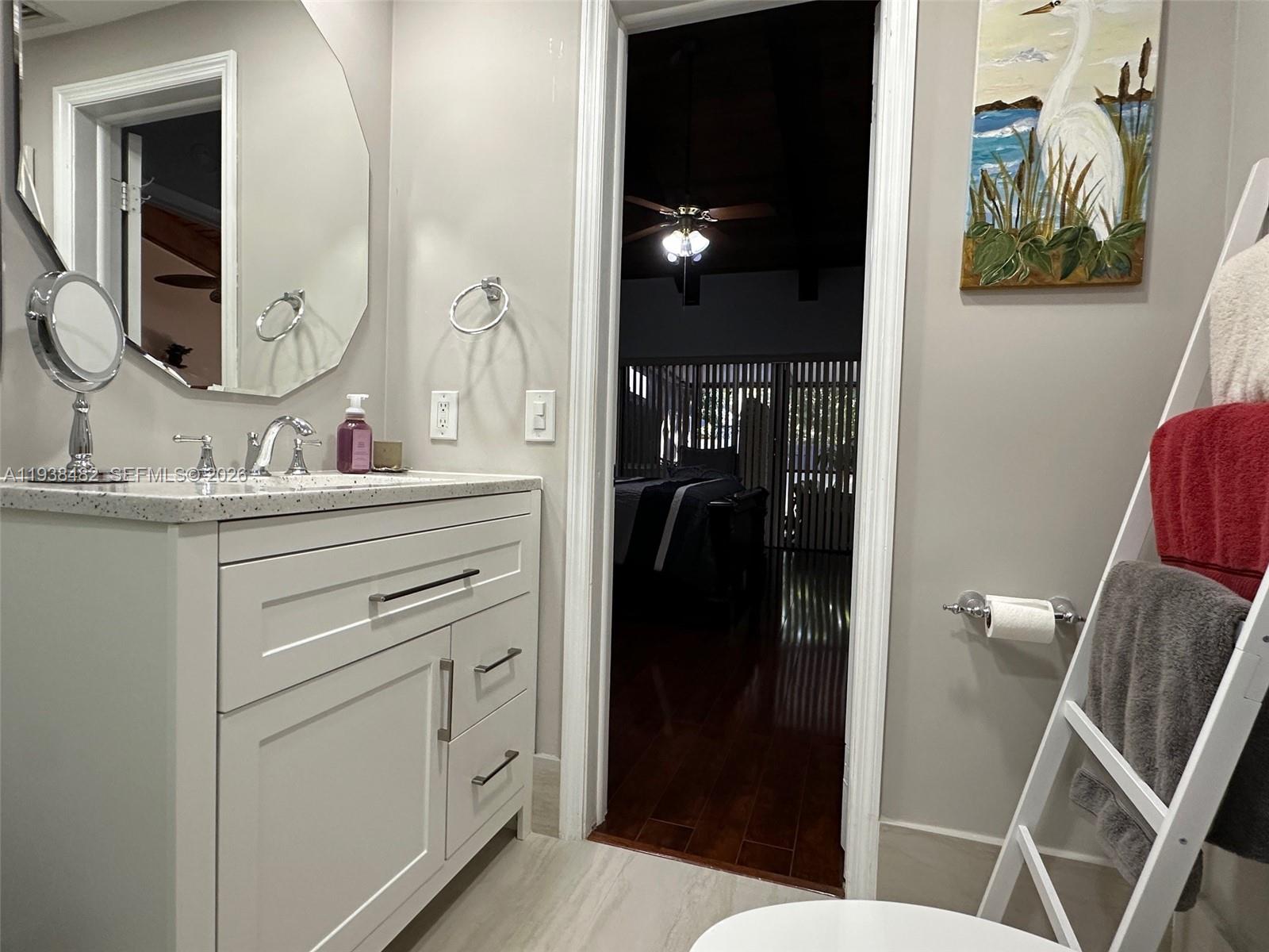 3415 Freedom Drive Hollywood, FL 33021 - Photo 45 of 49 a bathroom with a sink and a mirror