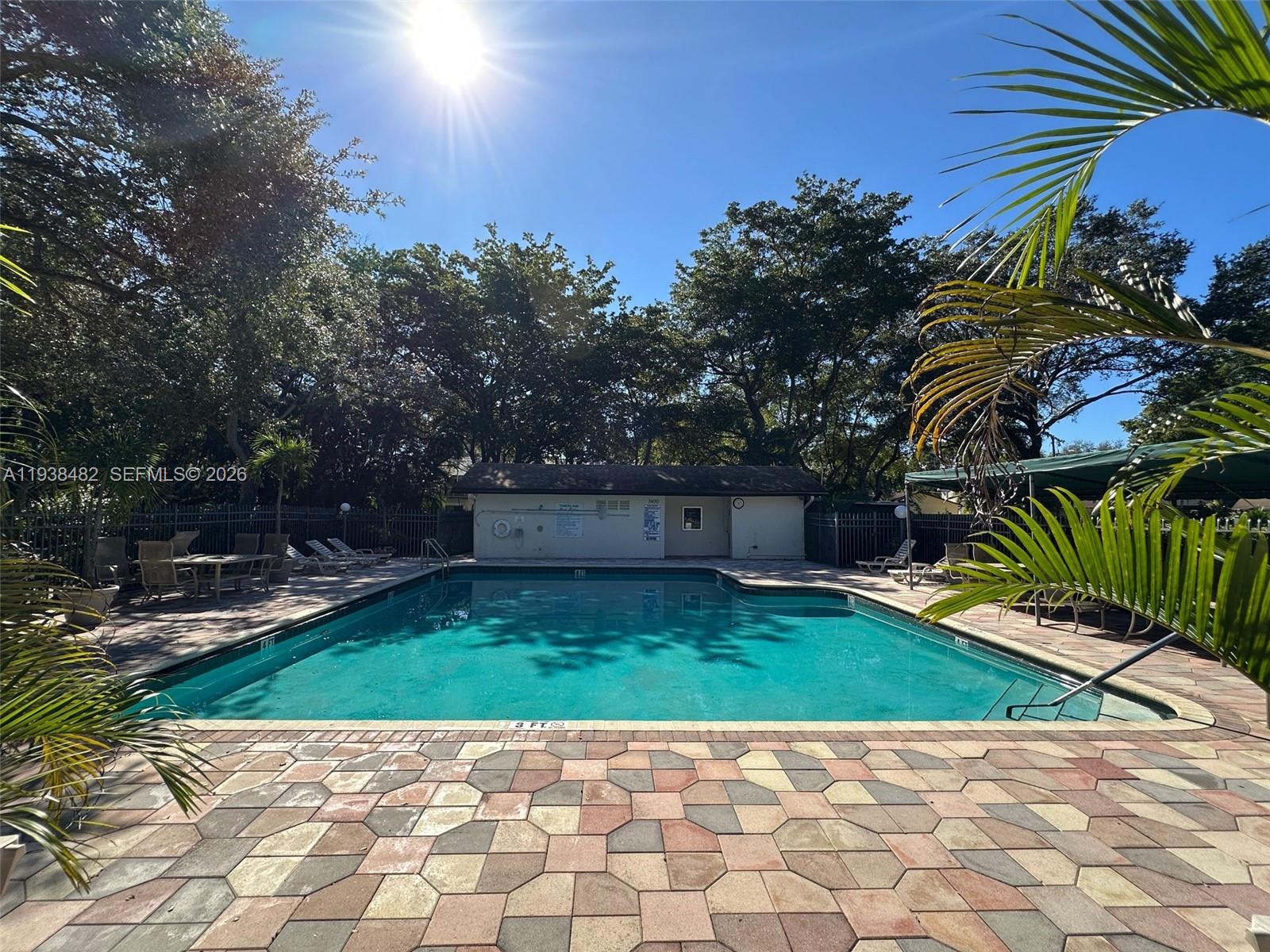 3415 Freedom Drive Hollywood, FL 33021 - Photo 47 of 49 a view of backyard with swimming pool and seating space