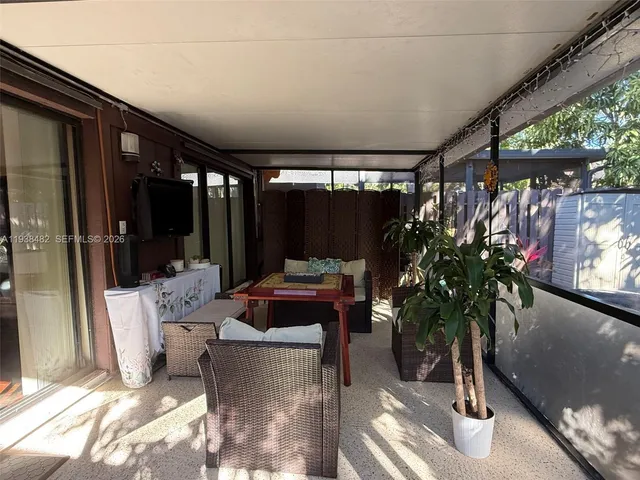 a outdoor living space with patio furniture and potted plants